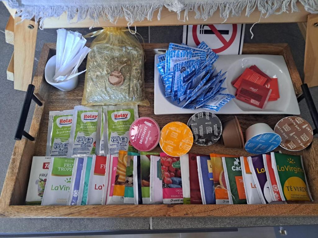 a shelf with books and other items on it at ENTREVID suites & spa in Anchoris