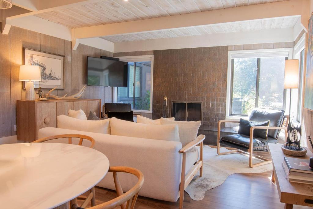 a living room with a couch and a table at Villager Condo 1240 in Sun Valley