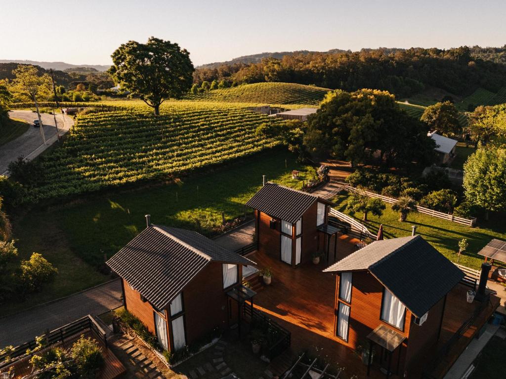 an aerial view of a house with a vineyard at Capanna del Vale - Refúgio & Degustação no Vale dos Vinhedos in Bento Gonçalves