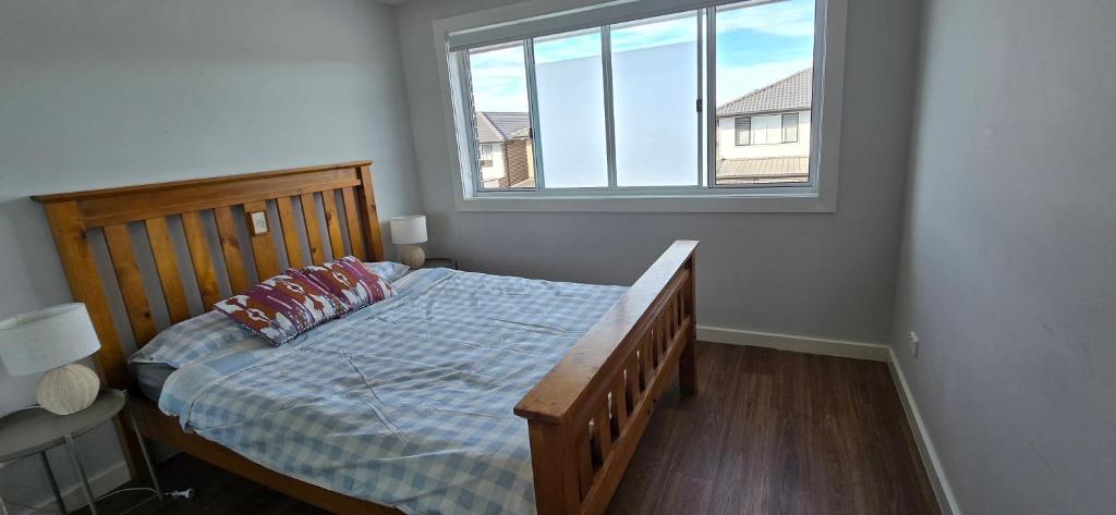 Postel nebo postele na pokoji v ubytování Spacious Famiy Living in the Heart of Marsden Park