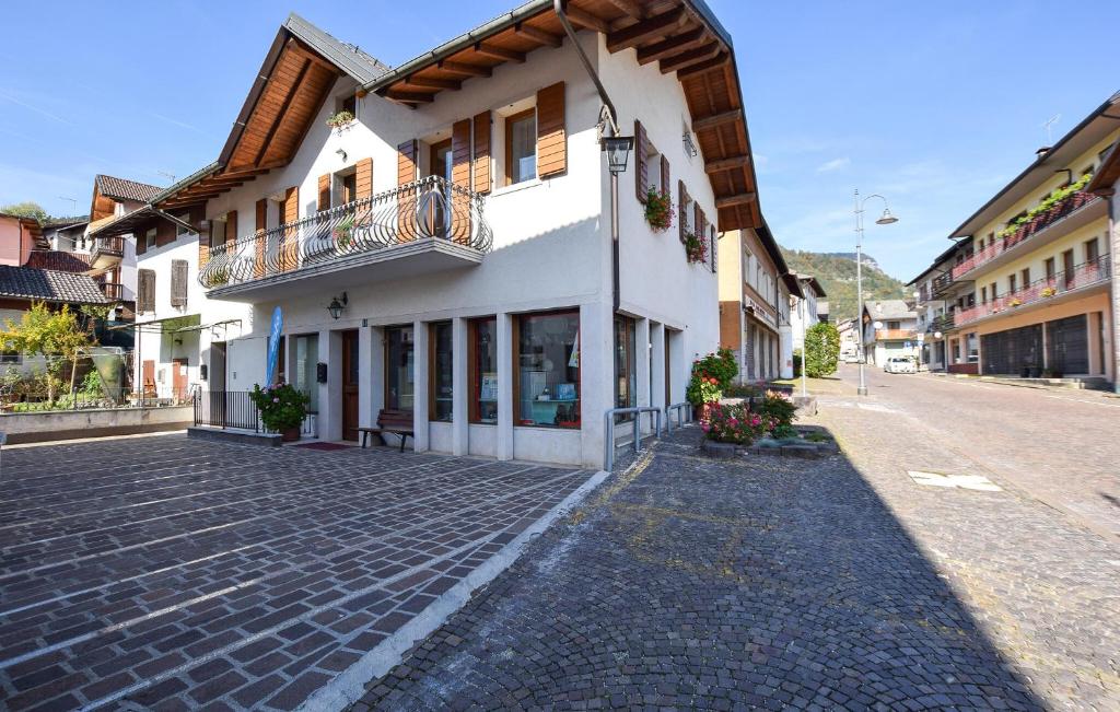 a cobblestone street in a town with a building at Gorgeous Apartment In Lamon With Wifi in Lamon