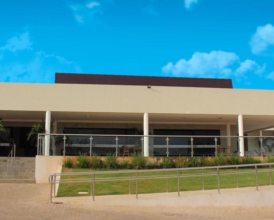 a building with a fence in front of it at Gurgueia Palace Hotel in Bom Jesus