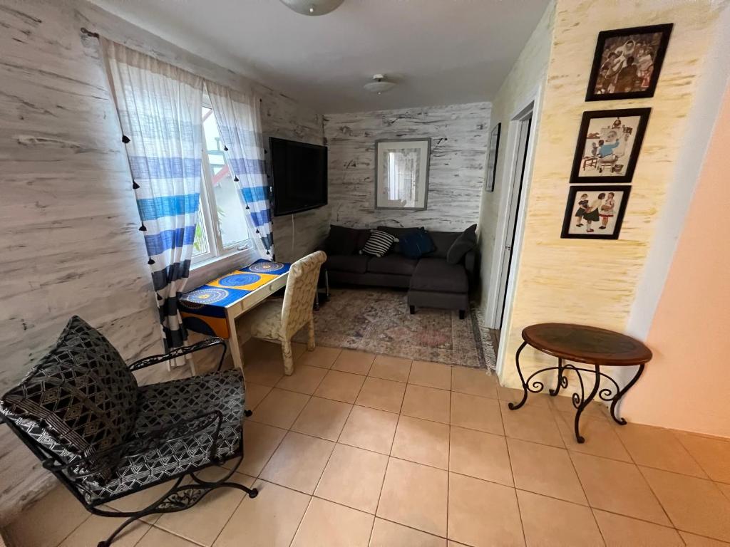 a living room with a couch and a table at Apartment Rosarito Beach Downtown (D) in Rosarito