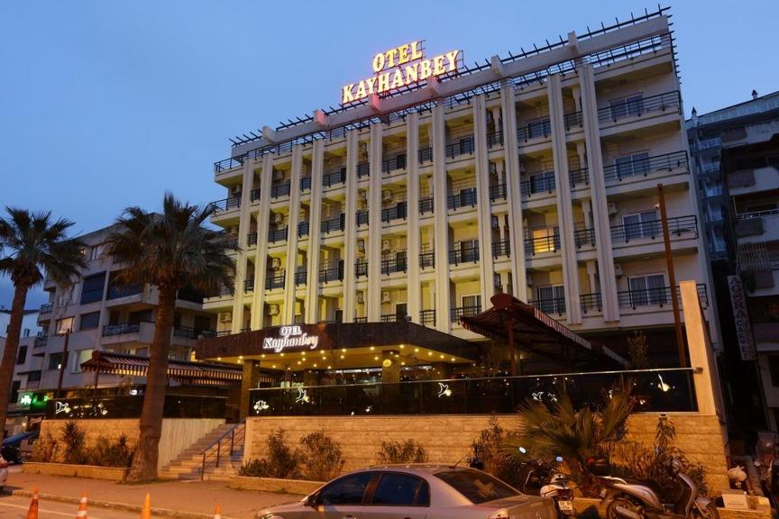 a large building with a sign on top of it at Kayhanbey Hotel in Kusadası