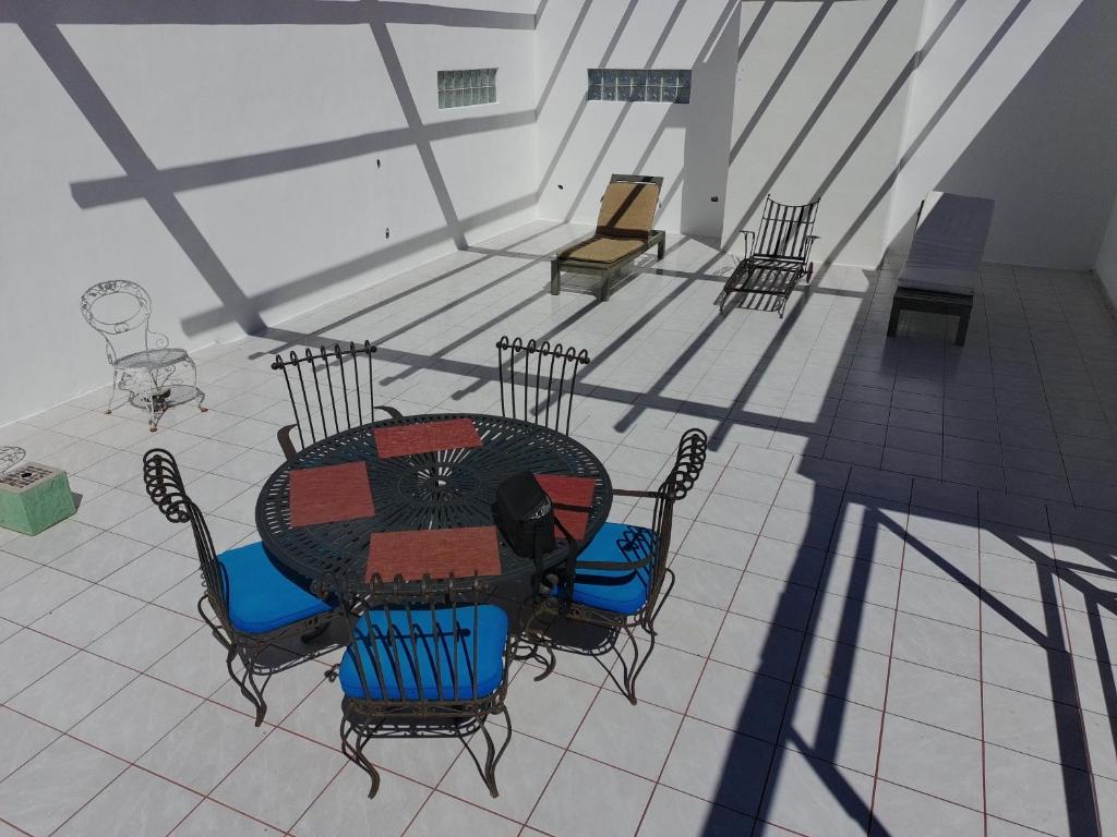 an empty room with a table and chairs at Apartment Rosarito Beach Downtown (D) in Rosarito
