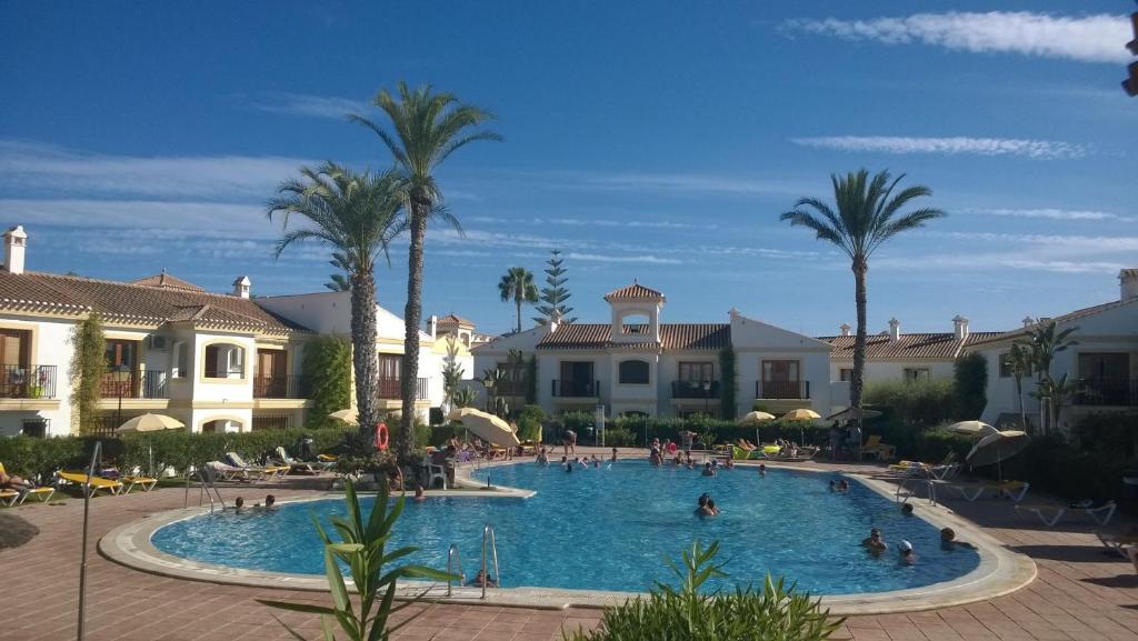 a pool at a resort with people in it at Paraíso Veracoast in Vera