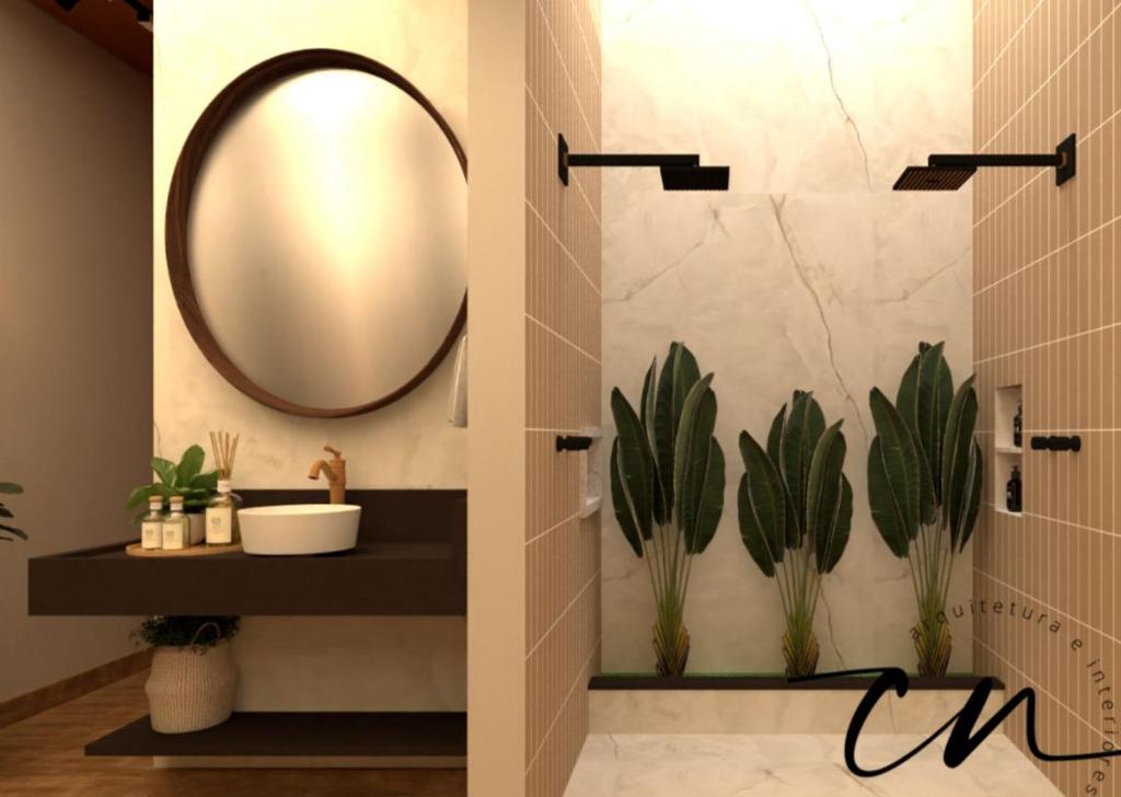 a bathroom with a mirror and plants on the wall at Pousada Grão & Vinha in Espirito Santo Do Pinhal