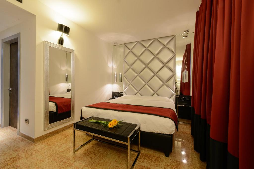 Postel nebo postele na pokoji v ubytování Corte Ongaro Hotel