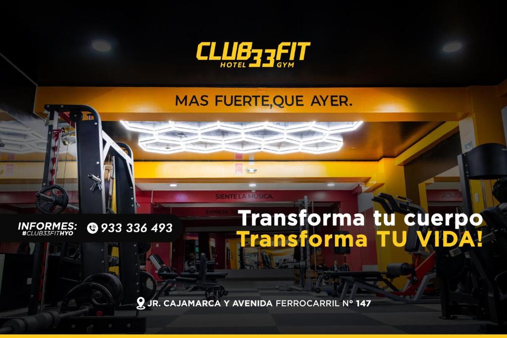 a gym with a sign on the front of it at CLUB 33 FIT Hotel Gym in Huancayo