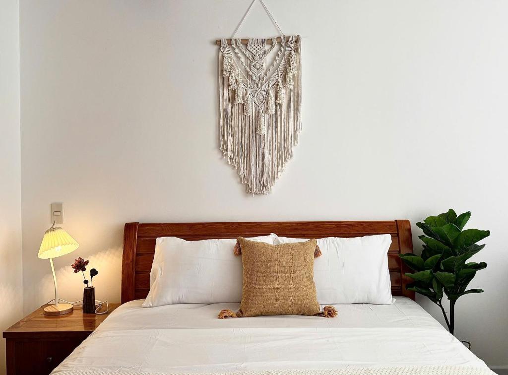 Ένα ή περισσότερα κρεβάτια σε δωμάτιο στο Rù Rì Homestay