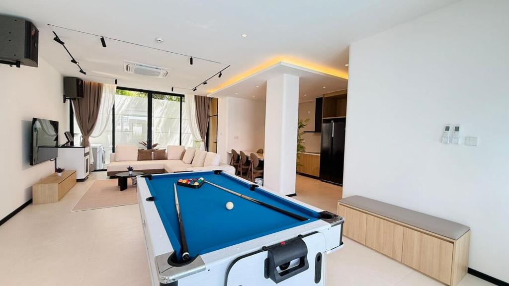 a living room with a pool table in it at Aura J23A - 8 in Pattaya Central