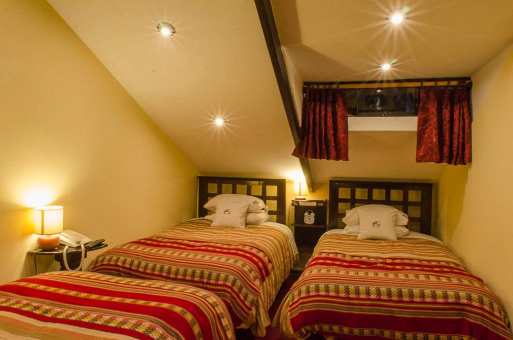 Letto o letti in una camera di Cusco Bed and Breakfast