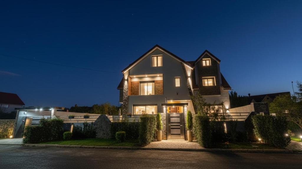 a house at night with its lights on at Villa Lumiere-Luxury Retreat with Private Spa and Garden in Ifrane