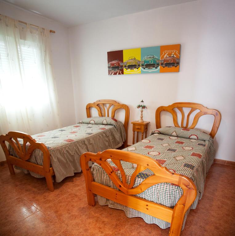 Postel nebo postele na pokoji v ubytování Casa Rural Marchena