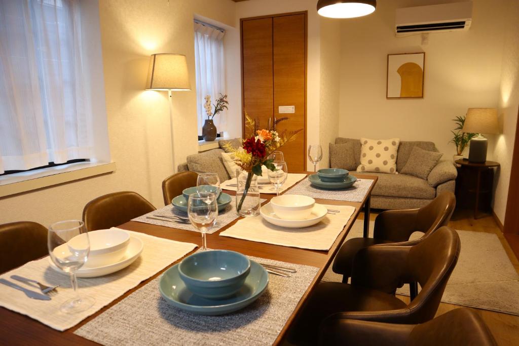 a dining room with a table and chairs at Shinkoiwa 3BR house in Tokyo