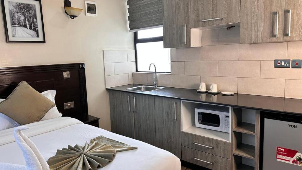 Η κουζίνα ή μικρή κουζίνα στο Toque &GN Accommodation Nairobi