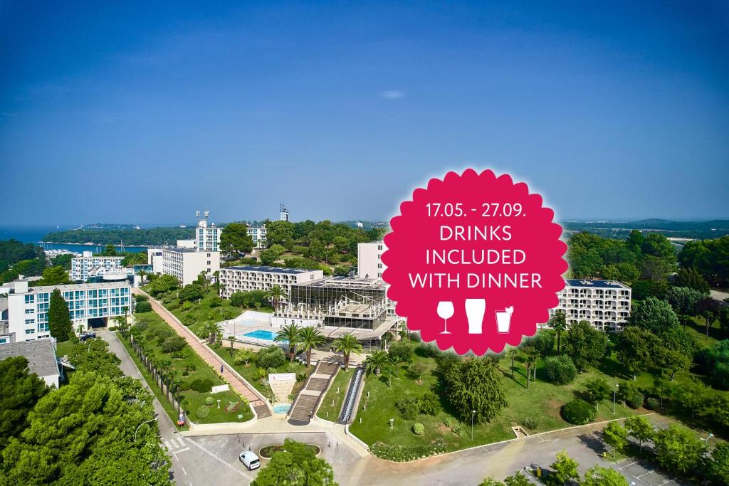 a sign that reads drinks included with dinner in a city at Hotel Istra Plava Laguna in Poreč