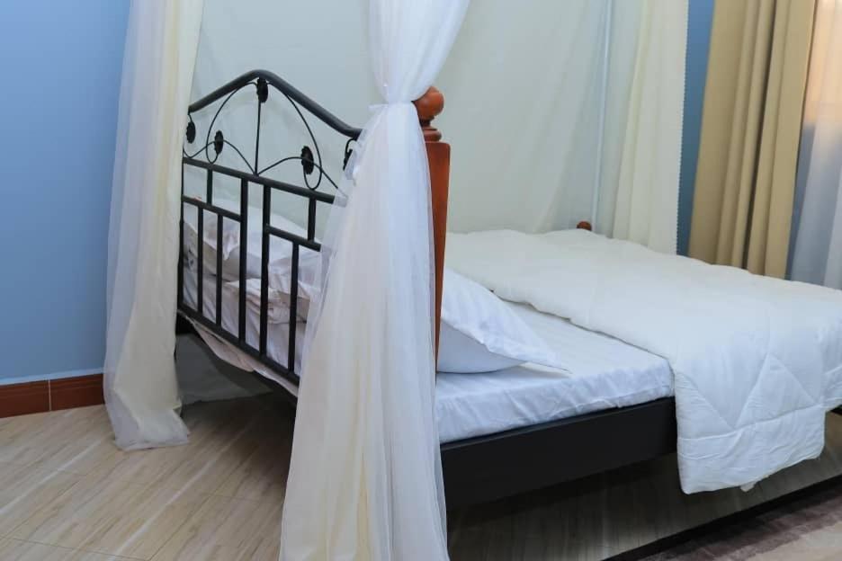 Postel nebo postele na pokoji v ubytování Kimani's Rock