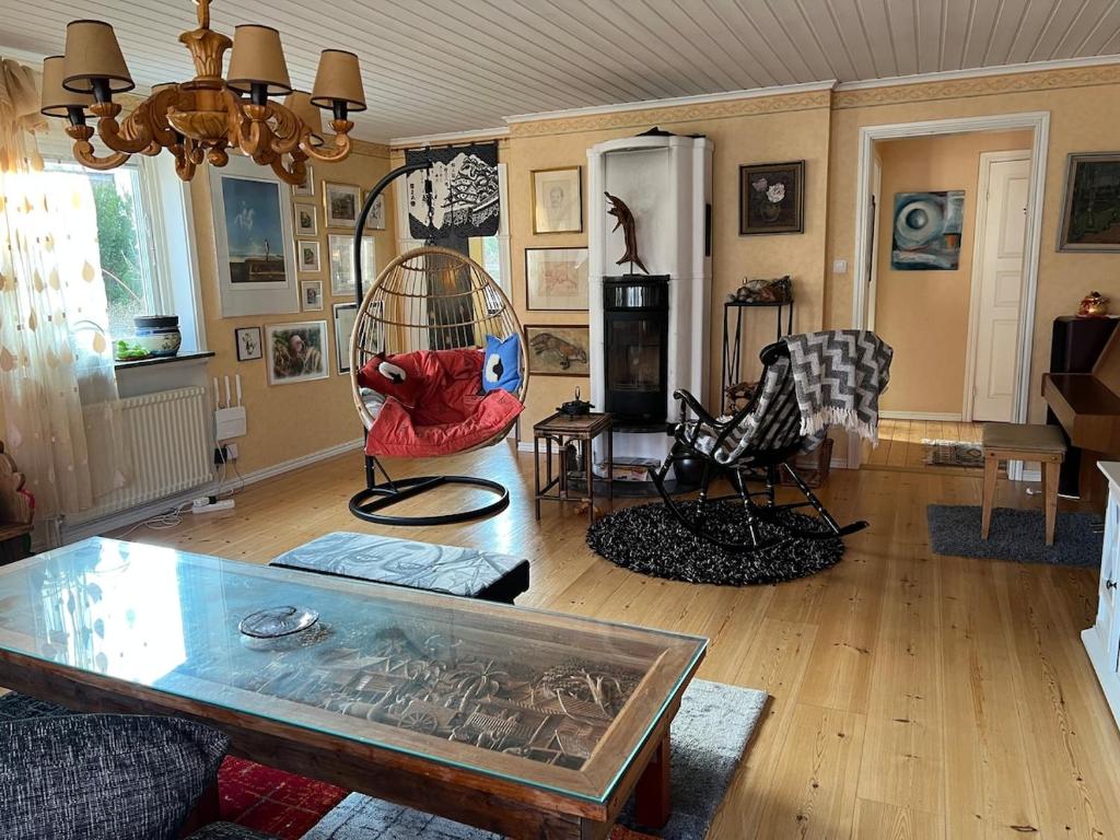 a living room with a table and chairs at Jägaregatan 10 in Tranås