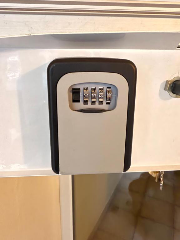 a kitchen drawer with a microwave oven on it at Quarto Duplo in Differdange