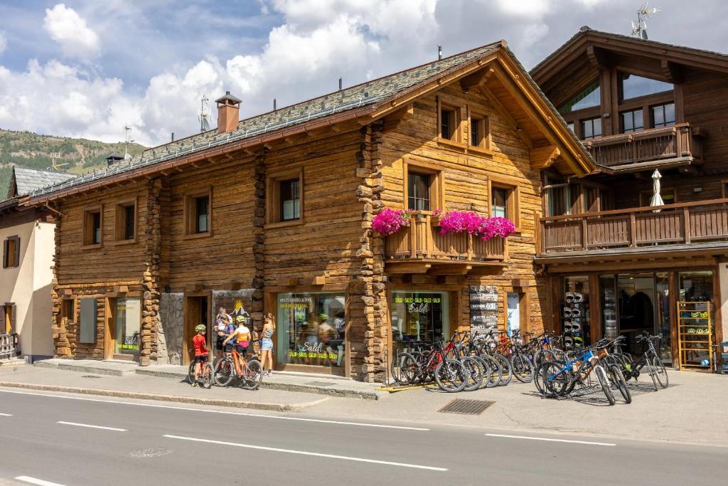 a building with a bunch of bikes parked in front of it at Chalet Silene in Livigno