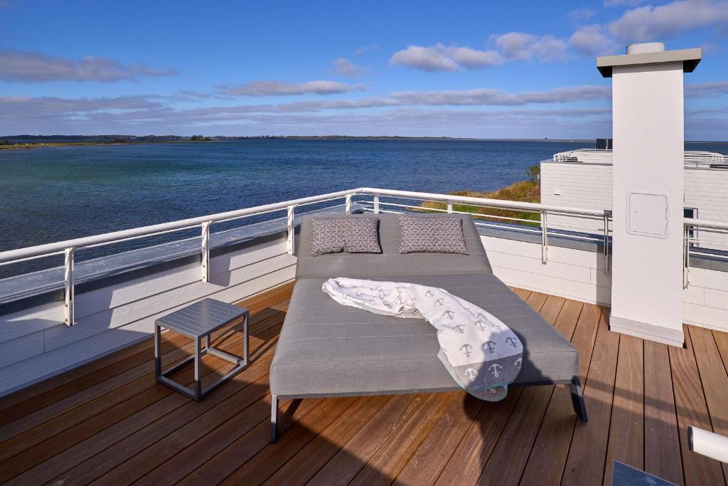 a bench on the deck of a cruise ship at Ferienhaus Saltkrokan Olpenitz in Olpenitz