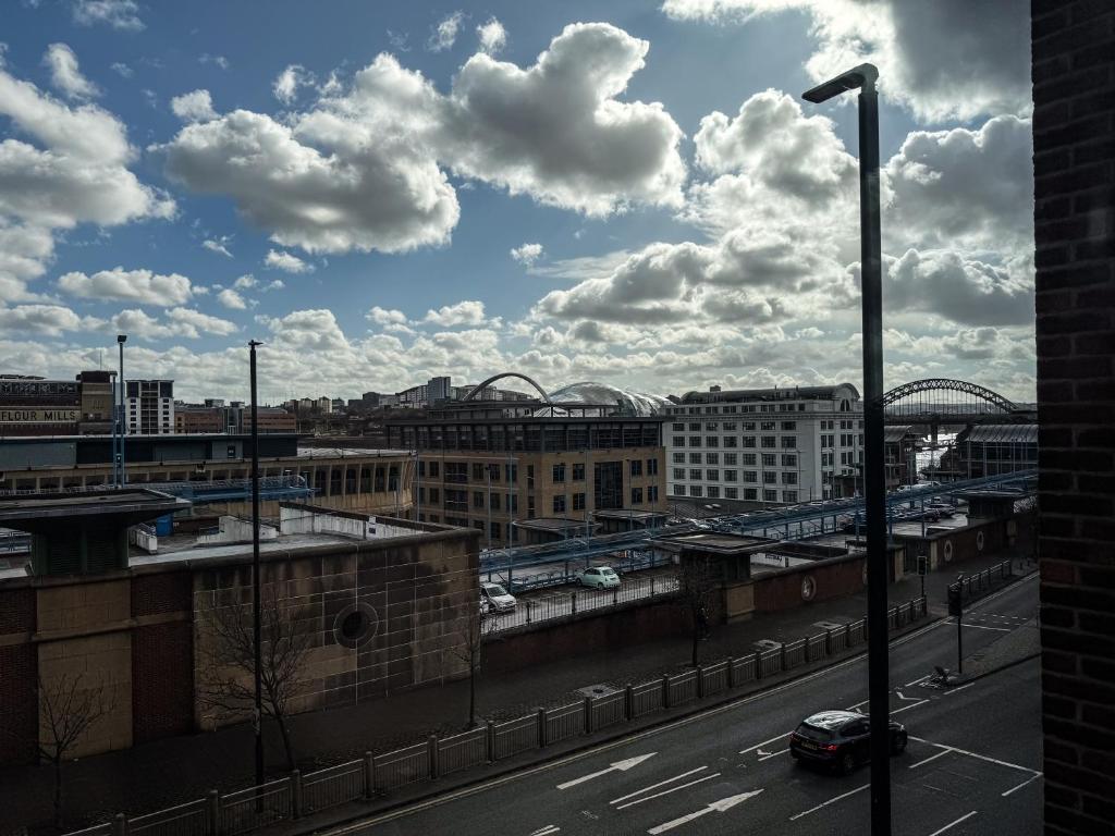 a view of a city from a parking lot at Modern City Centre Apartment - 2BR - Sleeps 8 - Parking & River Views in Newcastle upon Tyne