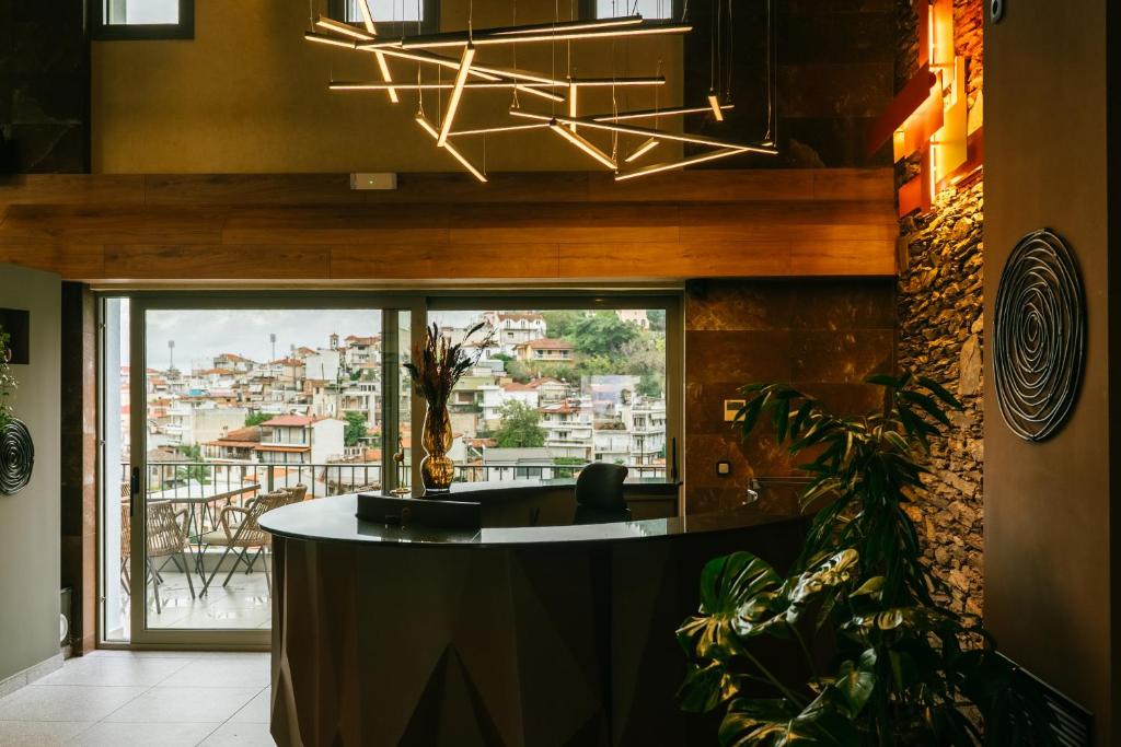 a bar with a view of a city at Trofonios Boutique Hotel in Levádeia