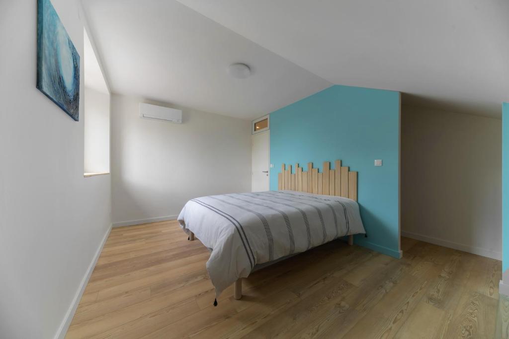 Postel nebo postele na pokoji v ubytování Résidence Penaud - Appartements design et climatisés à la campagne