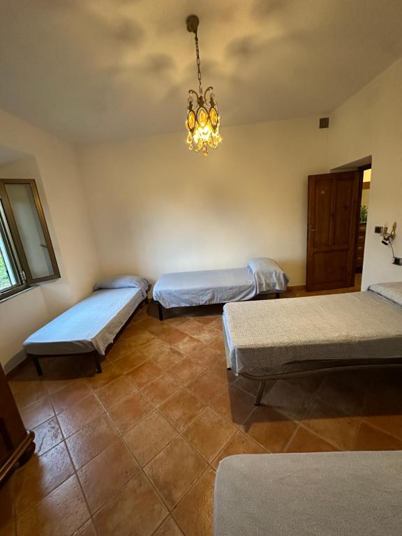 Ένα ή περισσότερα κρεβάτια σε δωμάτιο στο Casetta Pierluigi