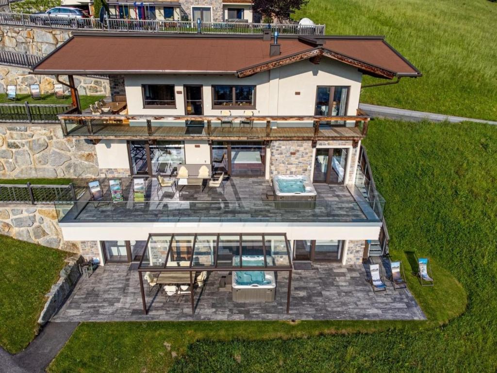an aerial view of a house with a deck and patio at Deluxe Suite Goldreh in Kaltenbach