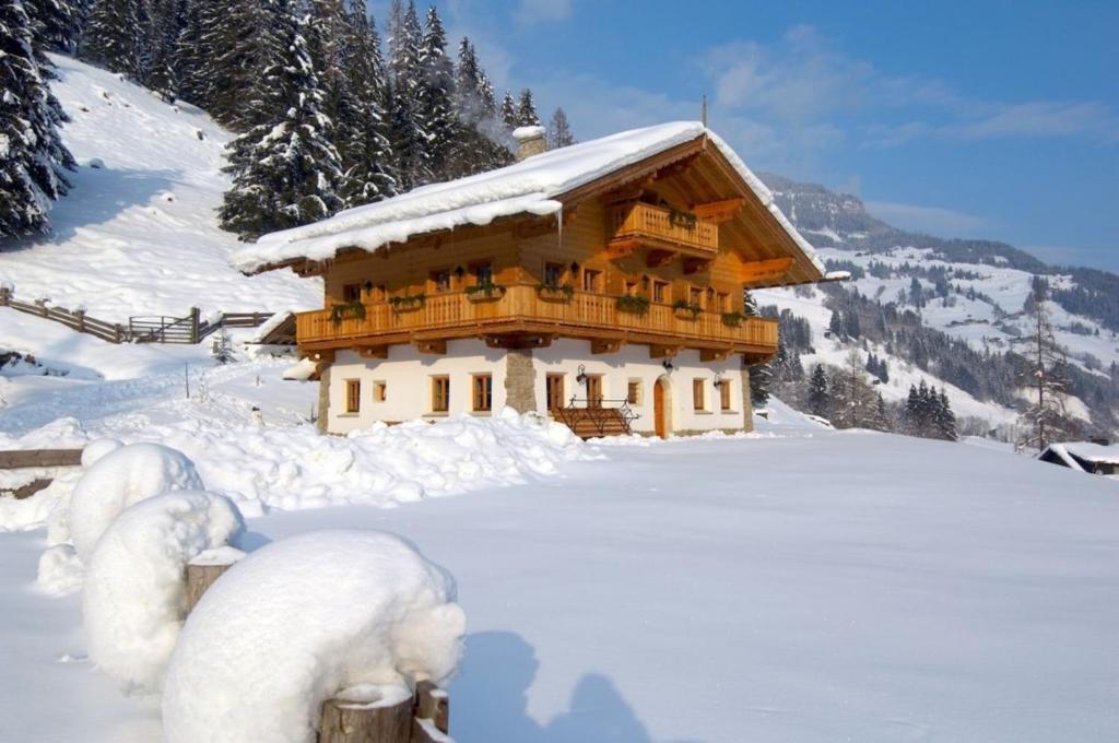 a small wooden building covered in snow at Chalet Kleinbretteneben in Unterberg