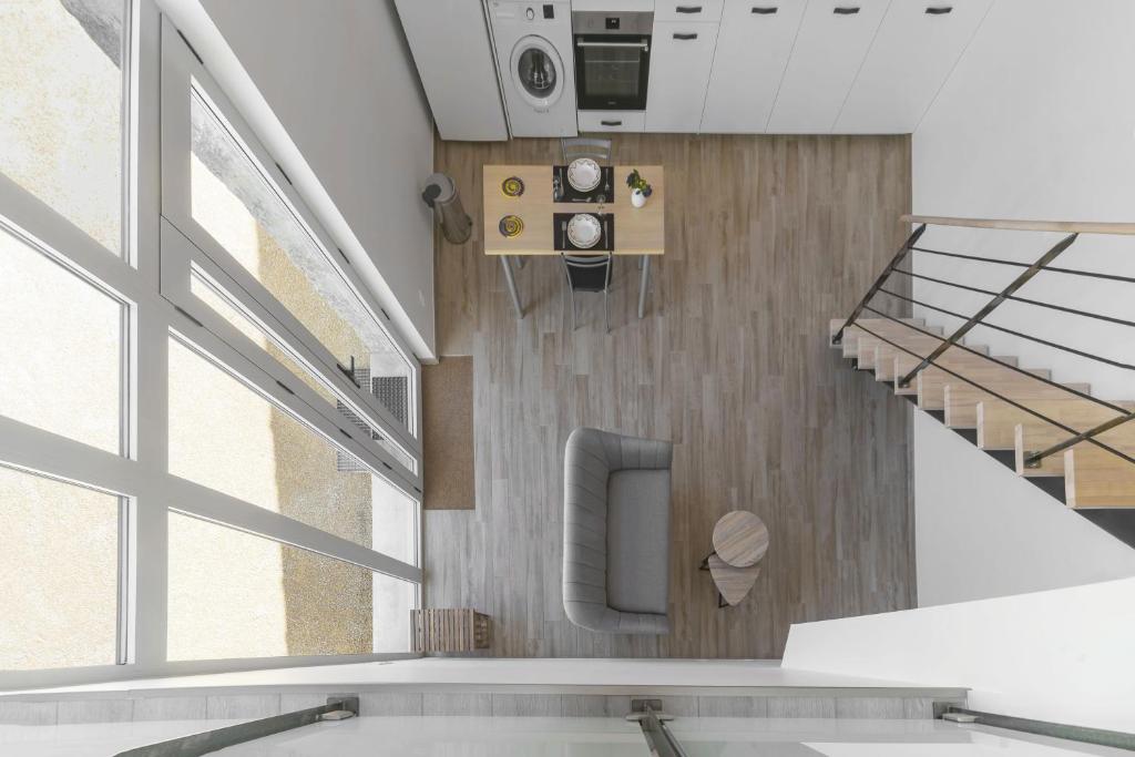 an overhead view of a hospital lobby with stairs at Résidence Penaud - Appartements design et climatisés à la campagne in Saulcet