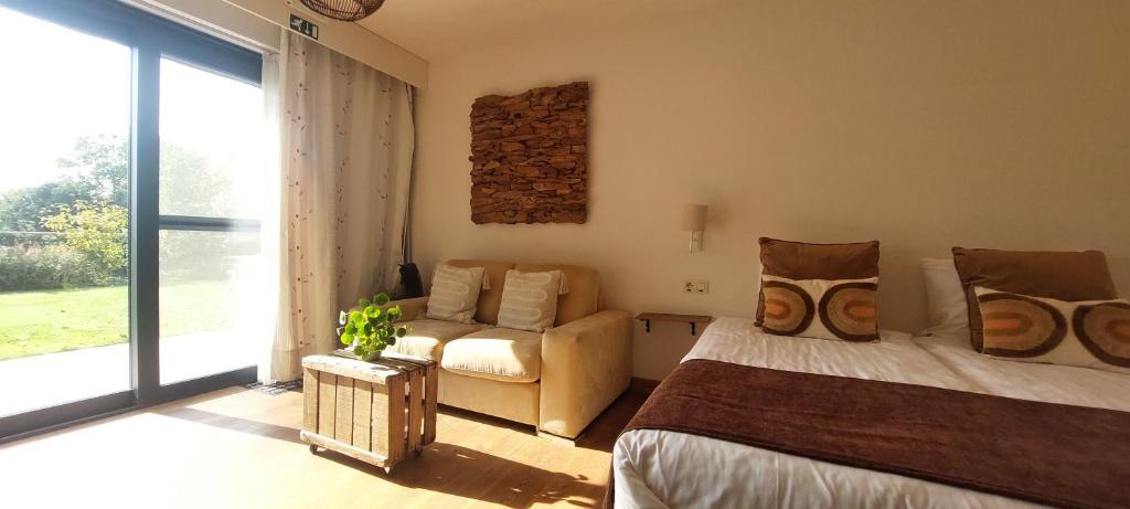 Postel nebo postele na pokoji v ubytování B&B 't Goedhof