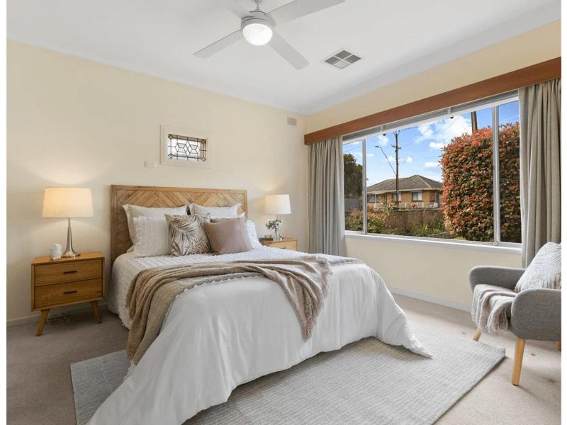 a bedroom with a bed and a large window at 3BR Guest House near Adelaide CBD Joslin 5070 in Evandale
