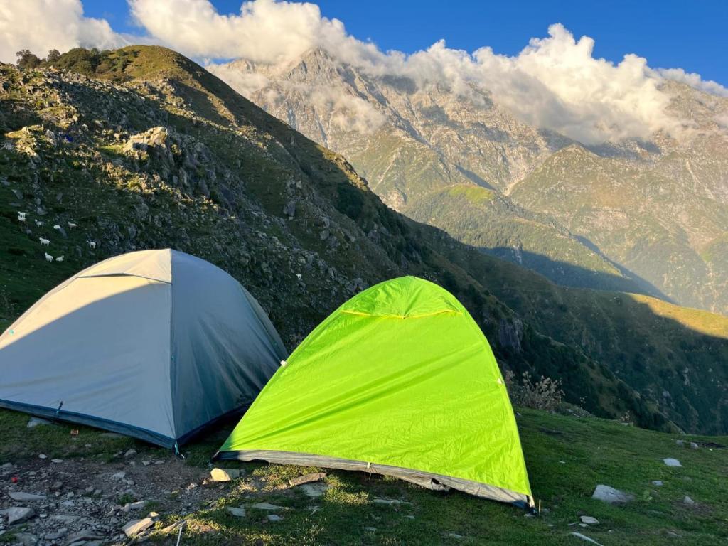 two tents sitting on top of a mountain at Himachal Adventure in Dharamshala