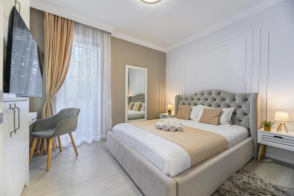 Postel nebo postele na pokoji v ubytování Ski Escape Poiana Brasov Residence