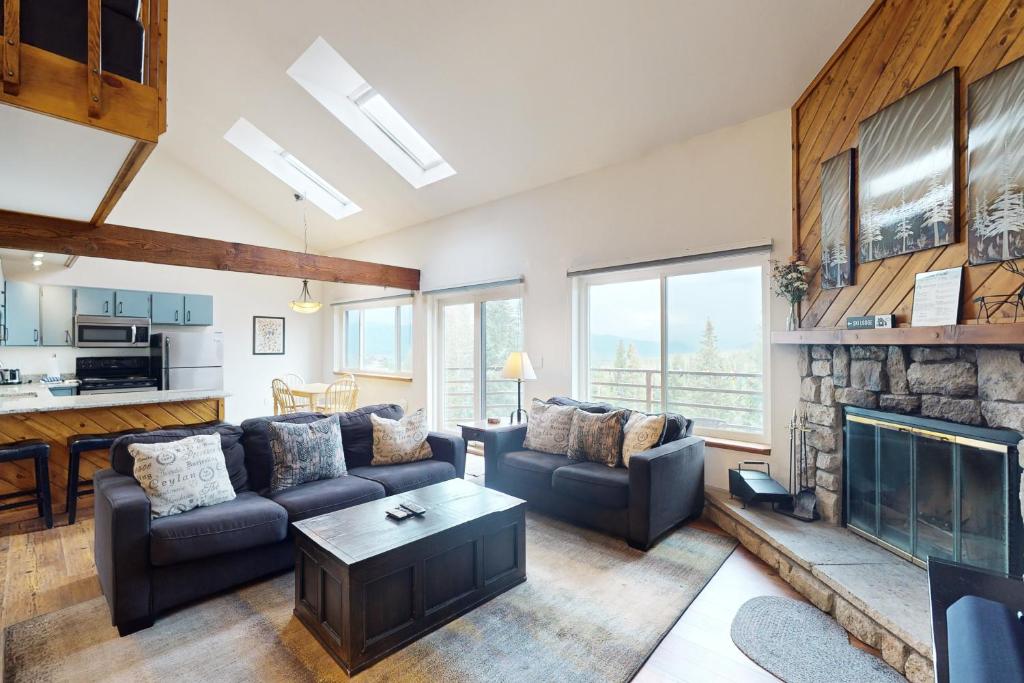 a living room with a couch and a fireplace at Buffalo Ridge C302 in Silverthorne