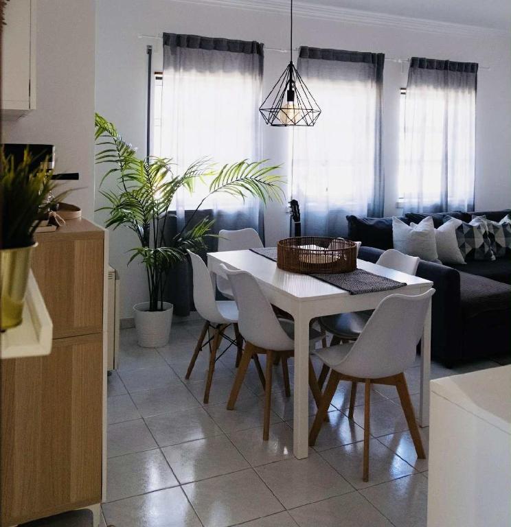 a living room with a white table and chairs at Maresia Baleal House in Baleal