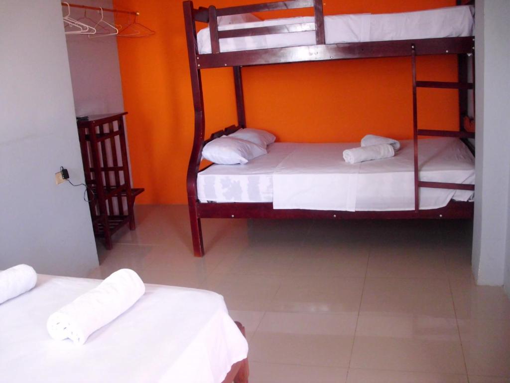Postel nebo postele na pokoji v ubytování Hostal Alcazaba