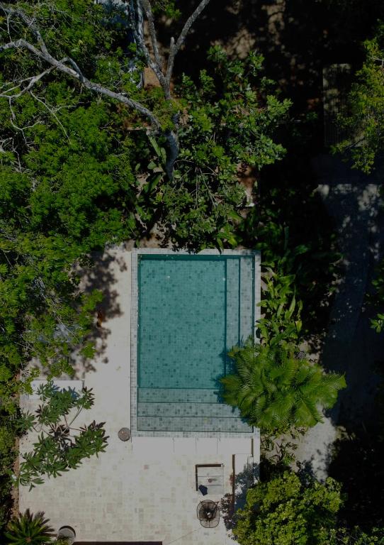 an overhead view of a swimming pool with trees at Pousada Vila Biribiri Trancoso in Trancoso