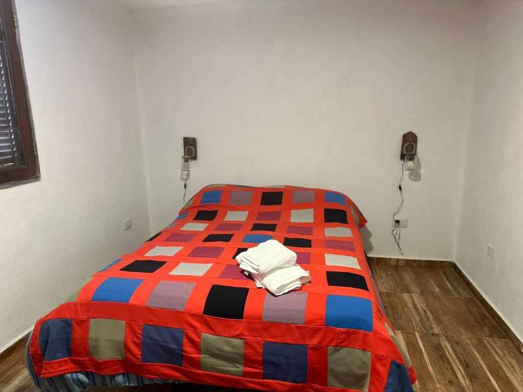 Postel nebo postele na pokoji v ubytování Cabaña El Quebrachal