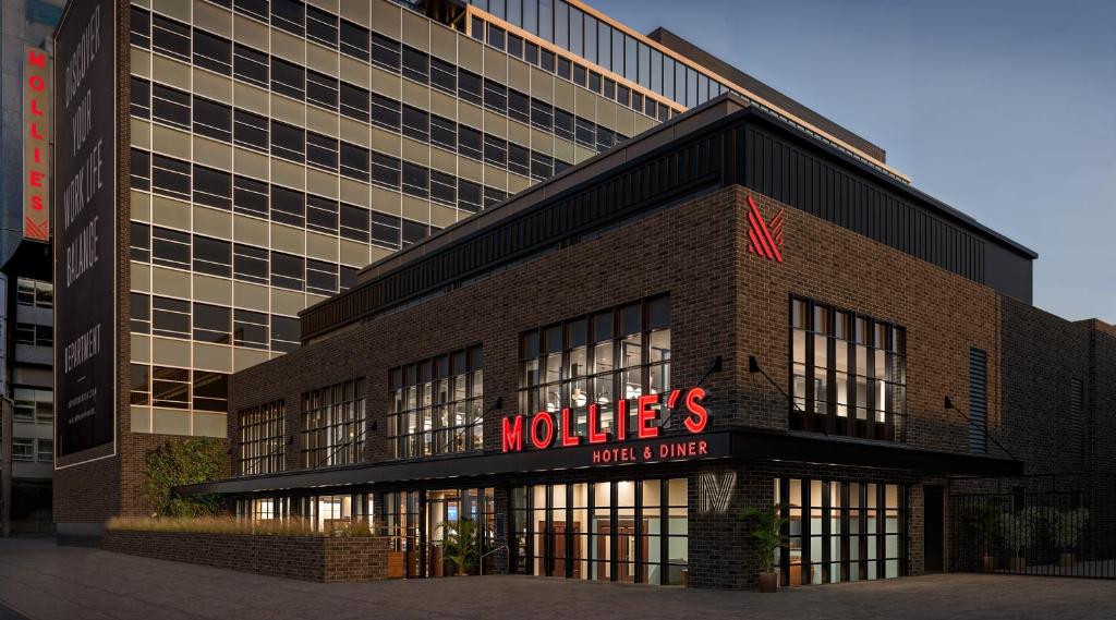a building with a hotel sign in front of it at Mollie's Manchester in Manchester