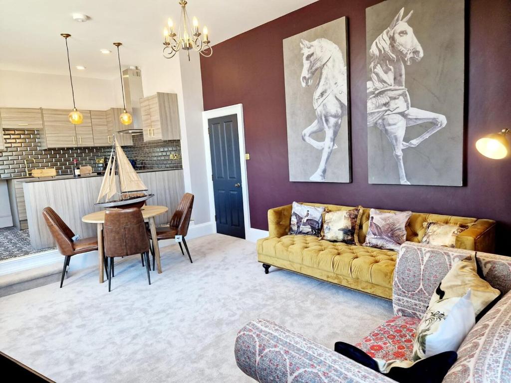 a living room with a couch and a table at Hamilton - The Hyde Luxury Let in Preston