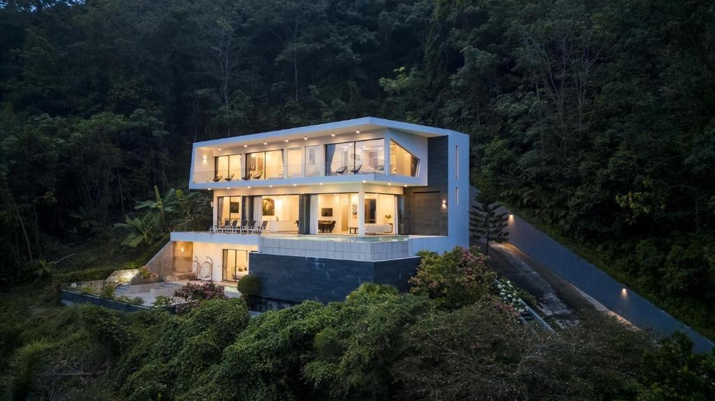 an aerial view of a house on a hill at Yamu Hills Panoramic Ocean View 6 Bed Luxury Vila in Phuket Town