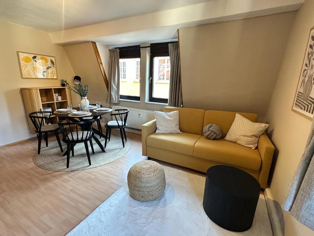 a living room with a couch and a table at Elbflorenz in Bad Schandau