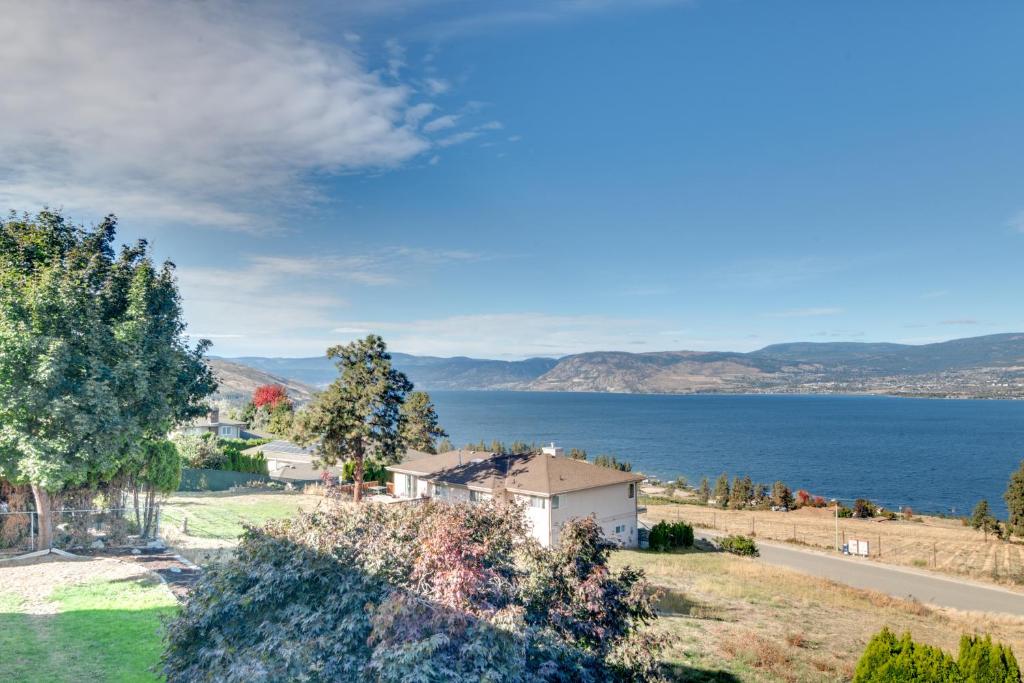 a house on a hill with a view of the water at Cozy Lakeview Retreat in Kettle Valley in Kelowna