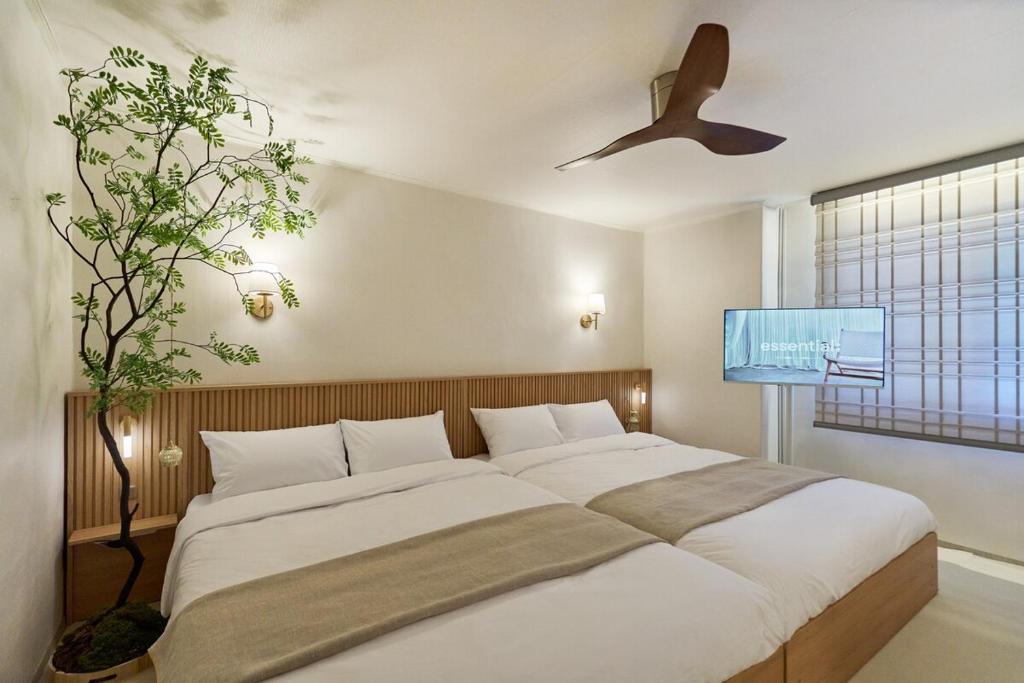 Postel nebo postele na pokoji v ubytování 둔촌트리하우스 Kspo