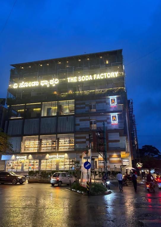 a building with a sign that reads the soda factory at Hotel Amigos in Bangalore