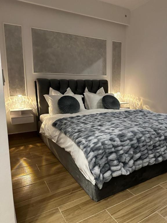 a bedroom with a large bed with lights on it at Apollo Studio 7 - Parking in Dudu